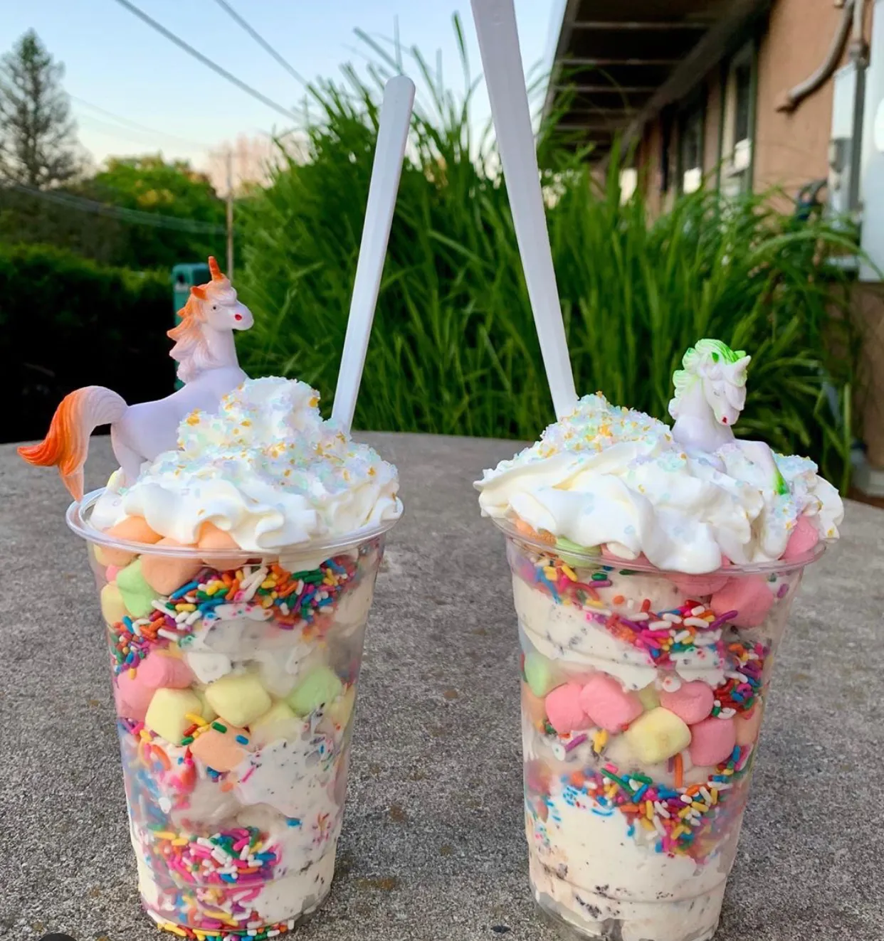 Two unicorn sundaes with marshmallows and sprinkles